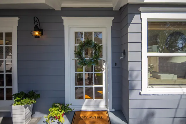 a view of front door and potted plants