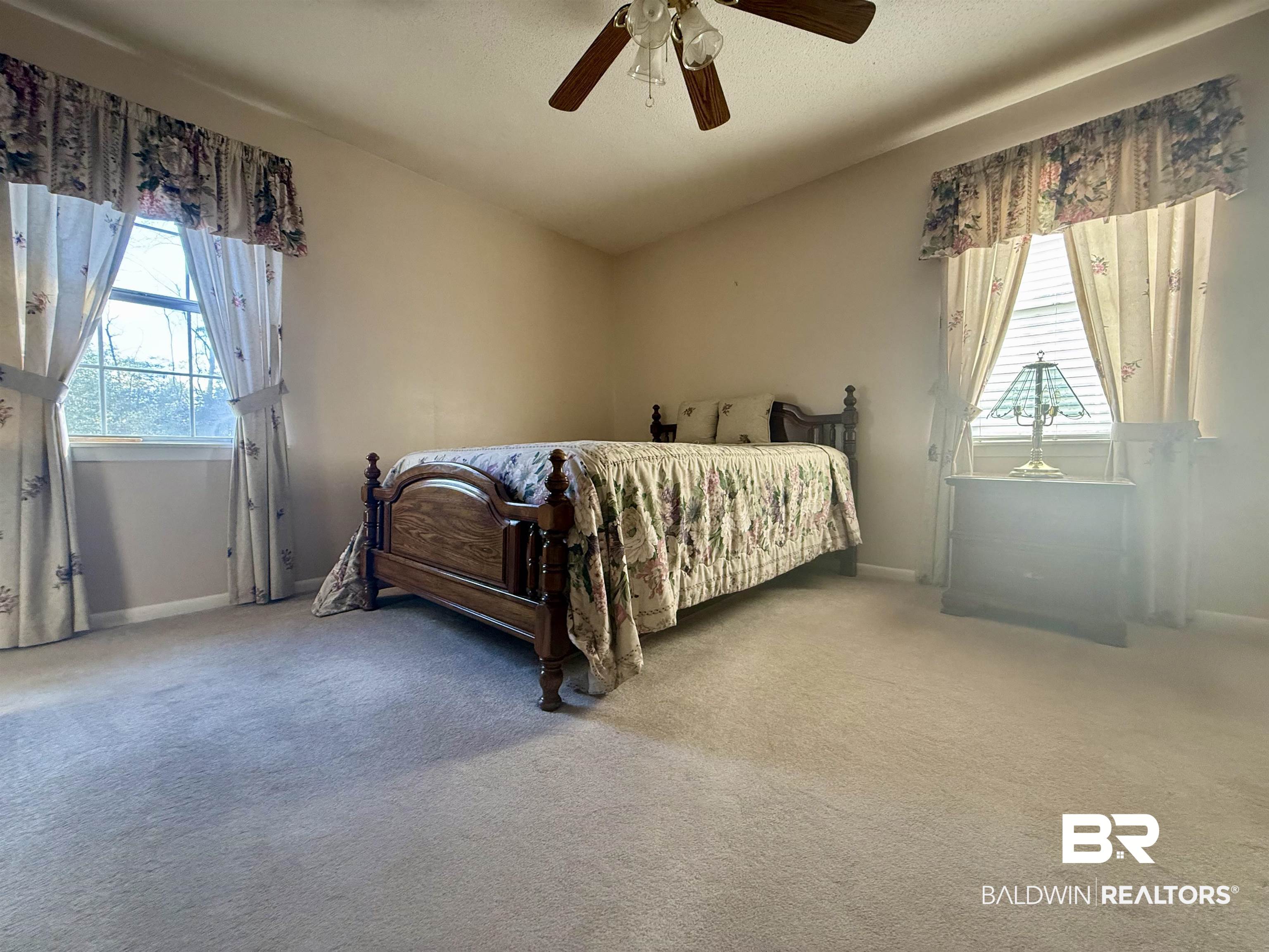 215 Young Street Brewton, AL 36426 - Photo 14 of 25 Bedroom featuring carpet floors and a ceiling fan