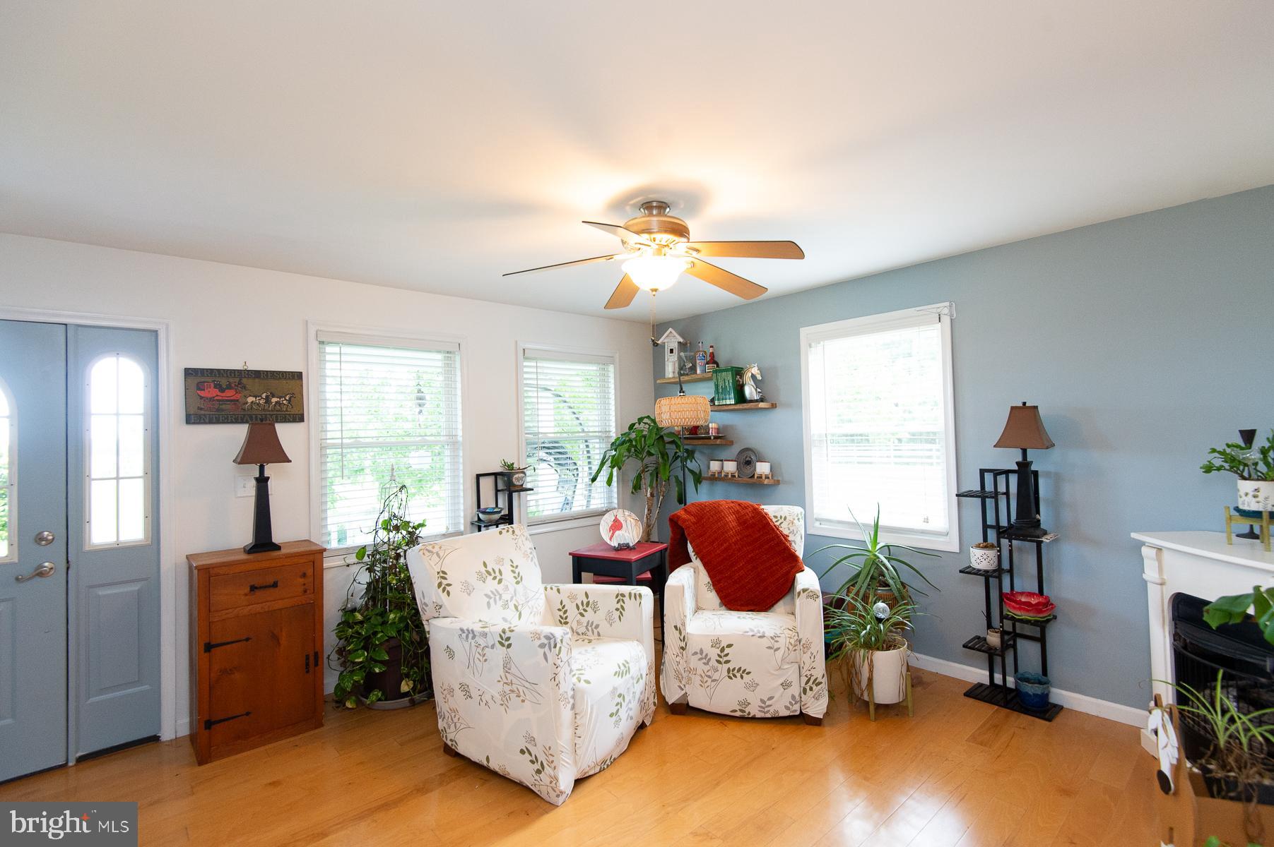 12136 Holly Road Ridgely, MD 21660 - Photo 11 of 136 a living room with furniture and a chandelier