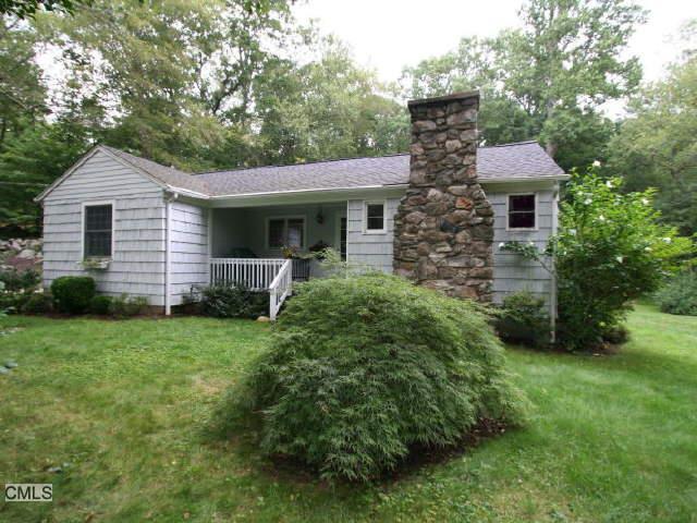 244 Grumman Hill Road Wilton, CT 06897 - Photo 1 of 1 a front view of a house with garden