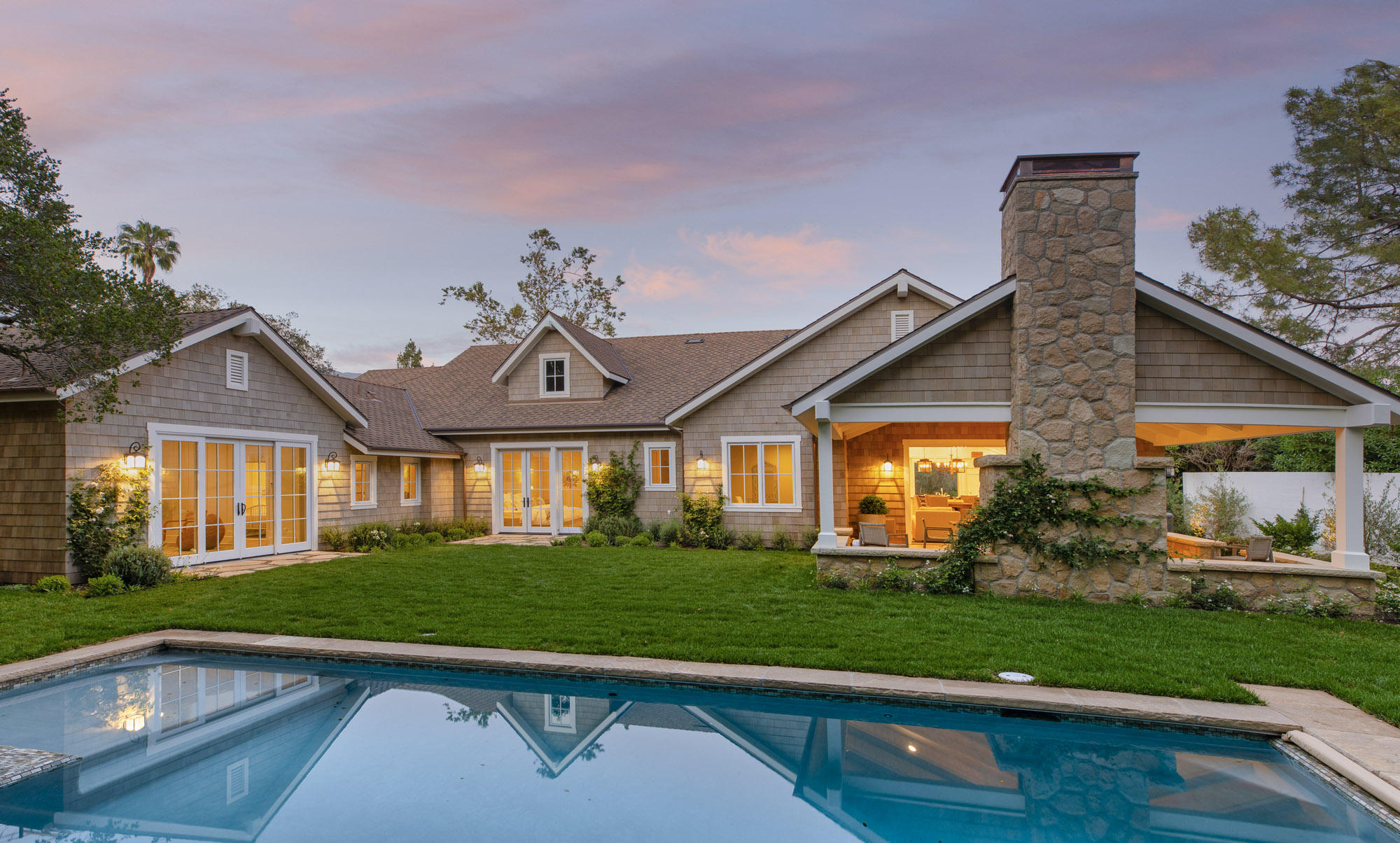 a front view of house with yard and green space