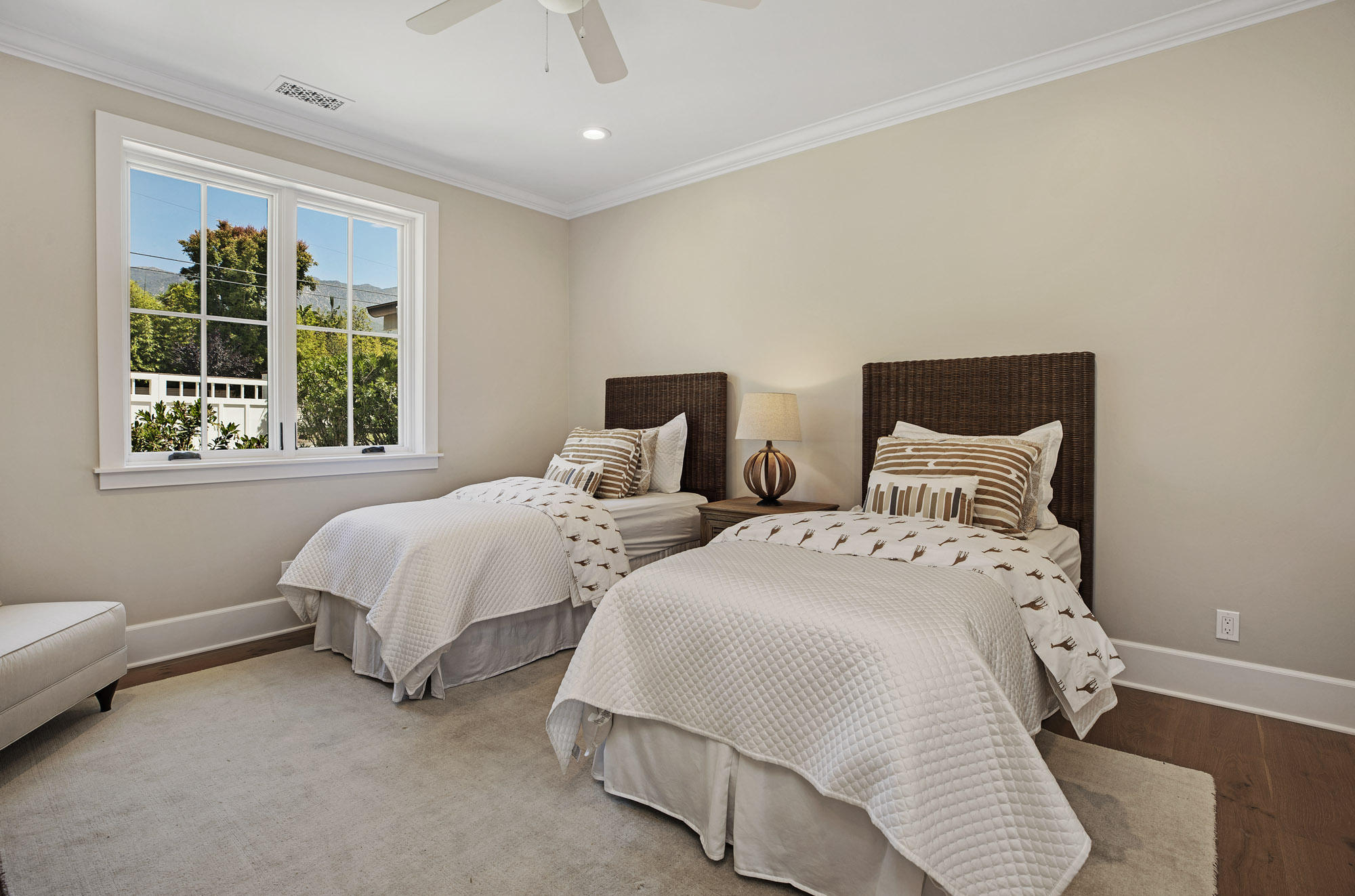 529 Santa Rosa Lane Montecito, CA 93108 - Photo 17 of 24 a bedroom with two beds and a window