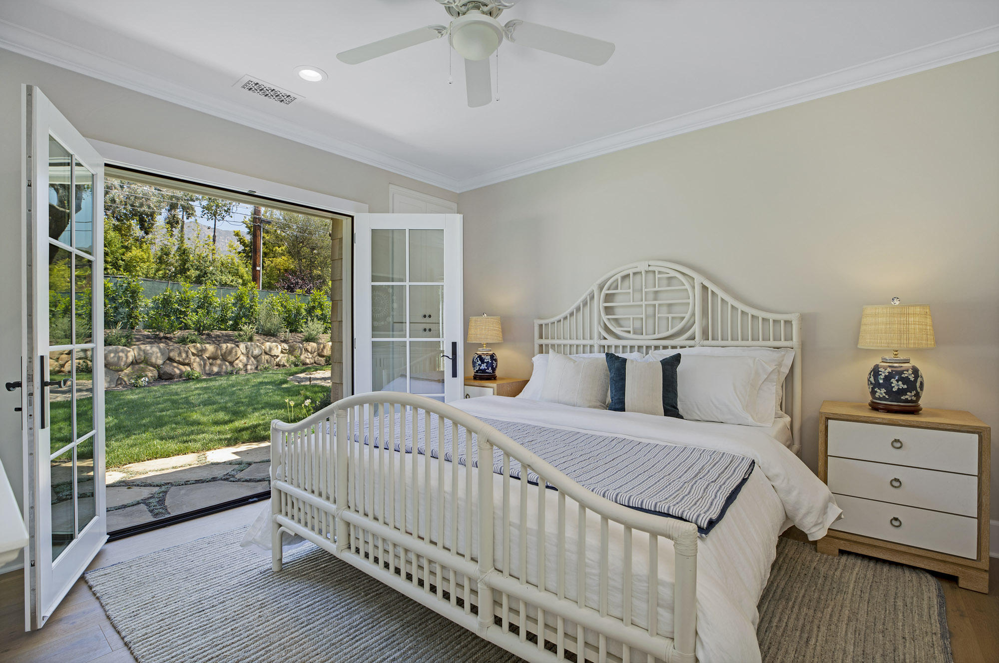 529 Santa Rosa Lane Montecito, CA 93108 - Photo 21 of 24 a bedroom with a bed and a chandelier