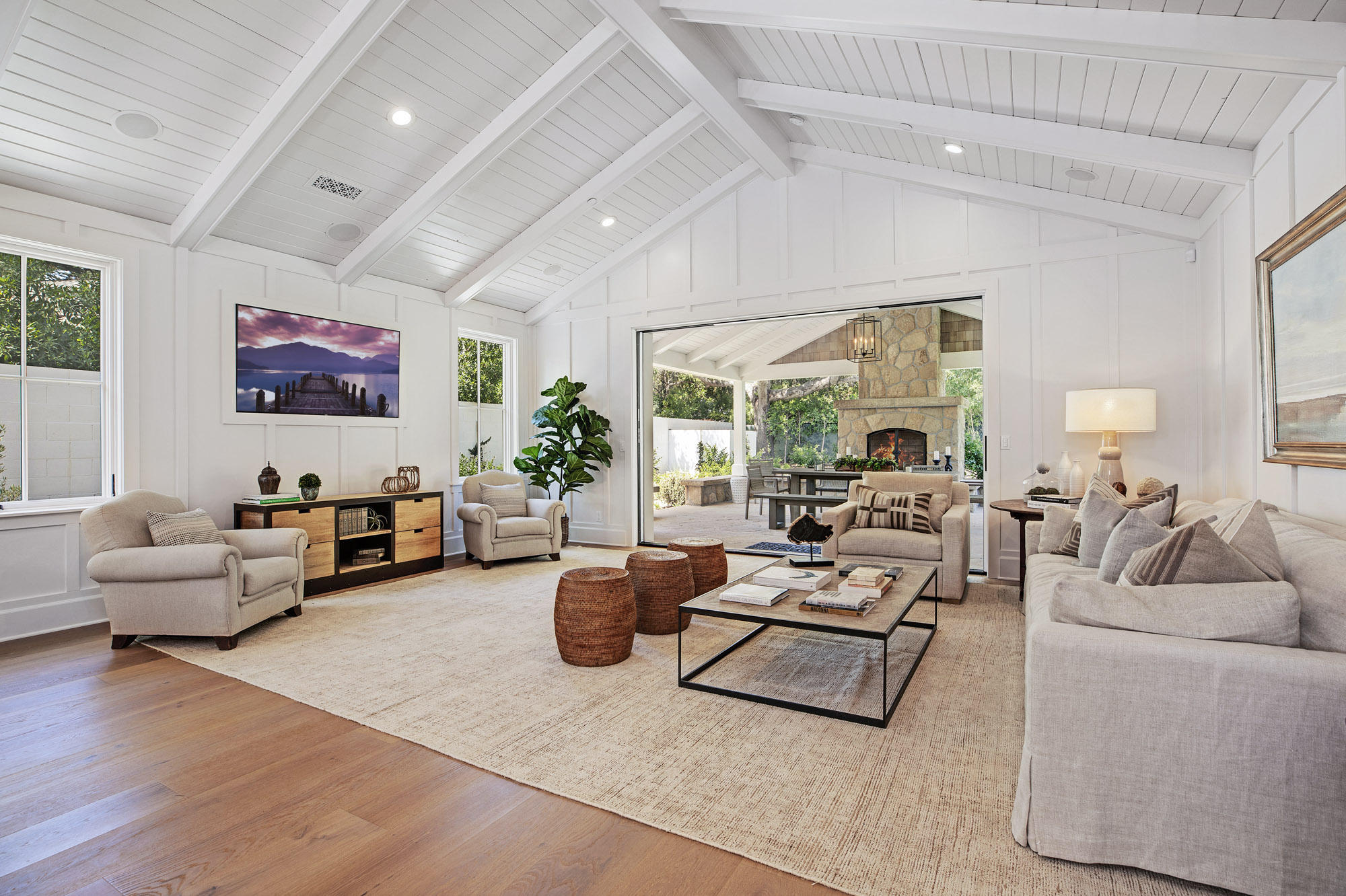 529 Santa Rosa Lane Montecito, CA 93108 - Photo 4 of 24 a living room with furniture large window and wooden floor