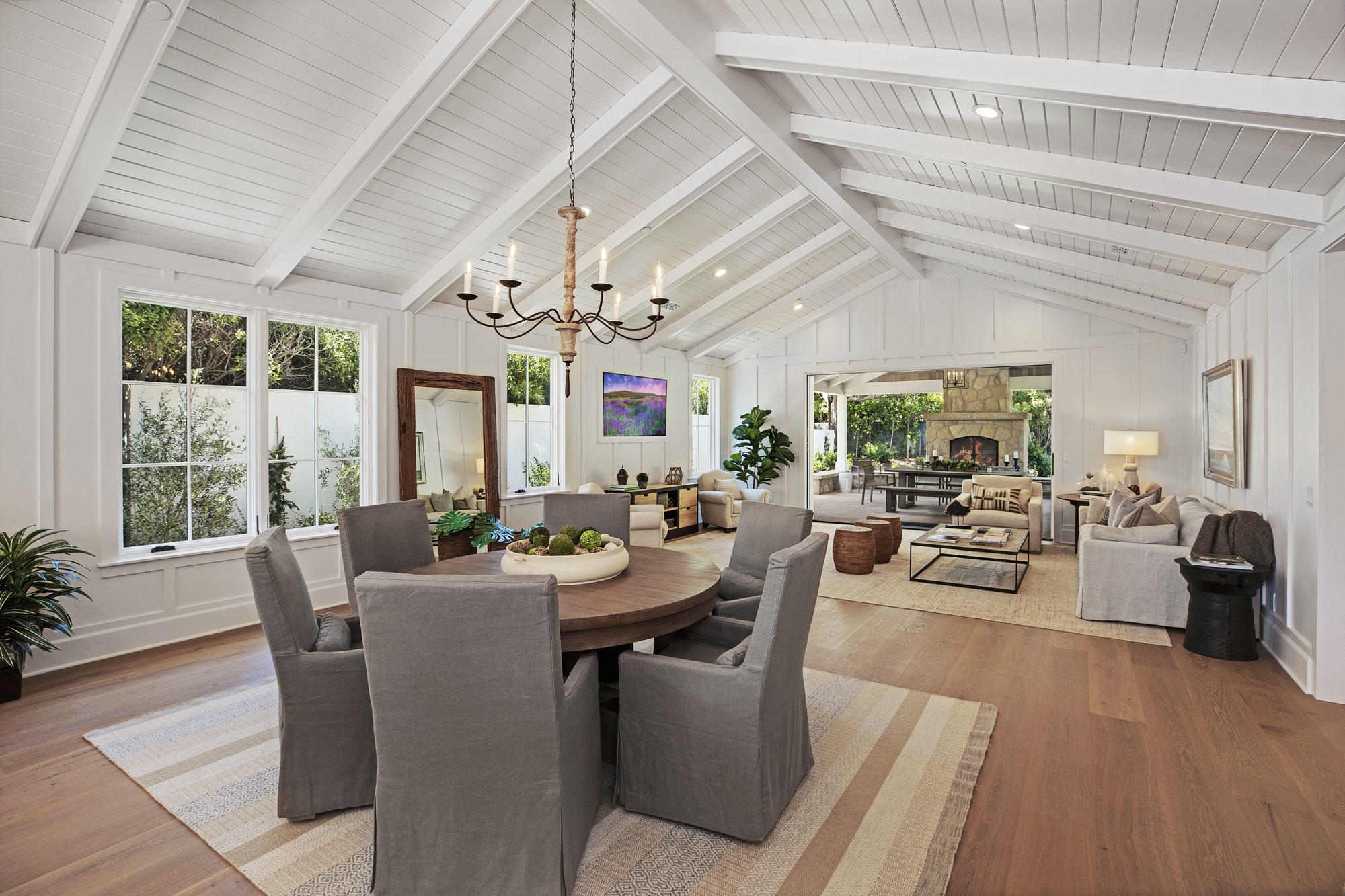 529 Santa Rosa Lane Montecito, CA 93108 - Photo 7 of 24 a view of a dining room with furniture large windows and wooden floor