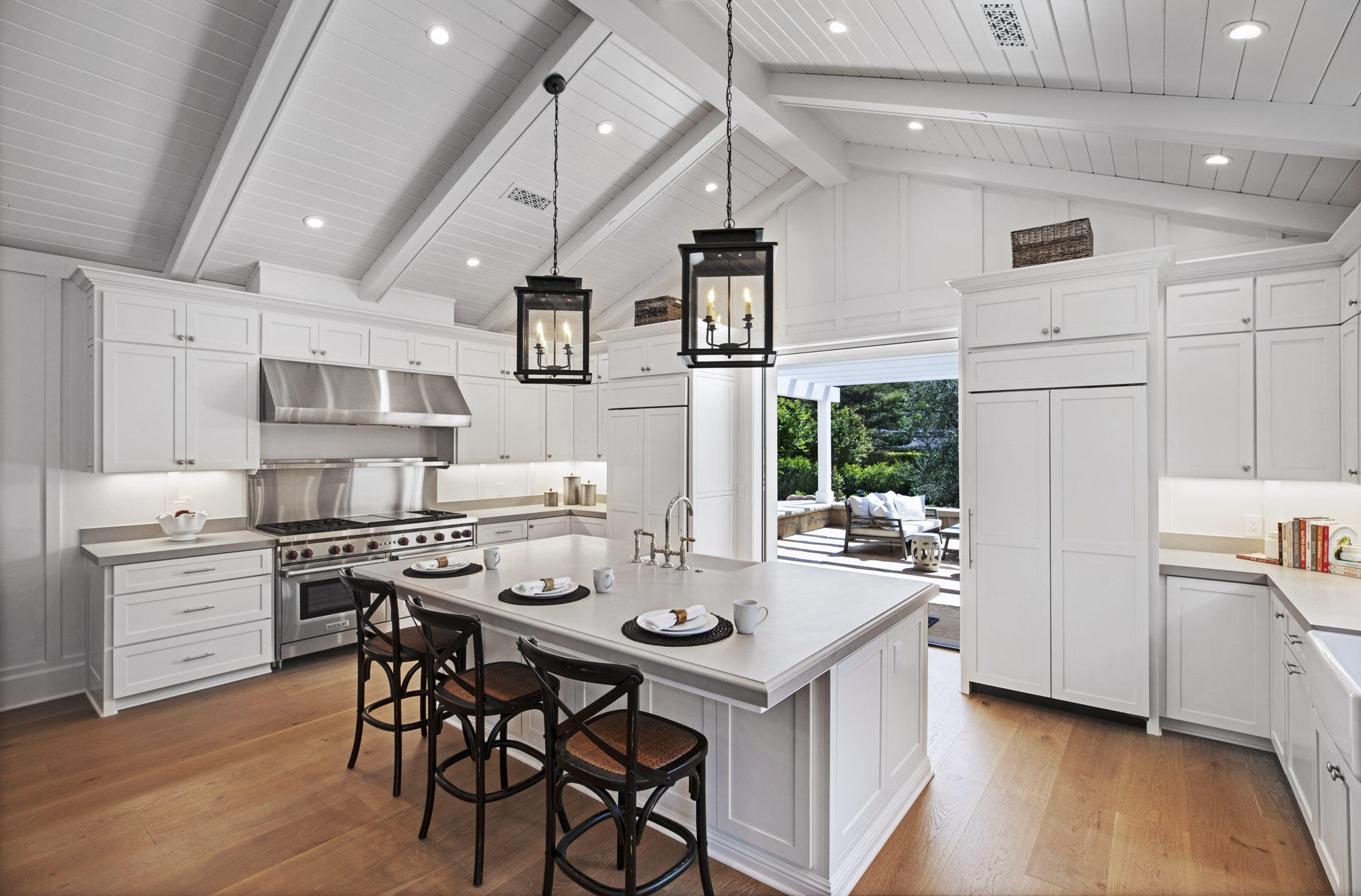 529 Santa Rosa Lane Montecito, CA 93108 - Photo 8 of 24 a kitchen with stainless steel appliances a dining table and chairs
