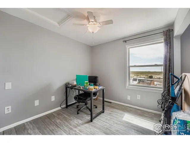 a workspace with furniture and a window
