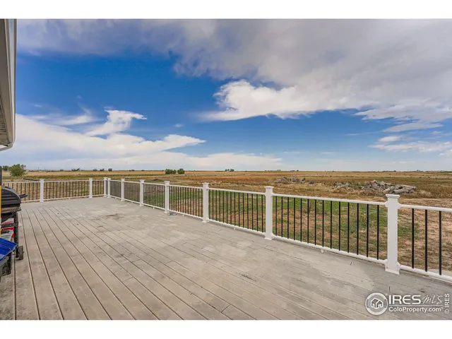 a view of a roof deck with sunset