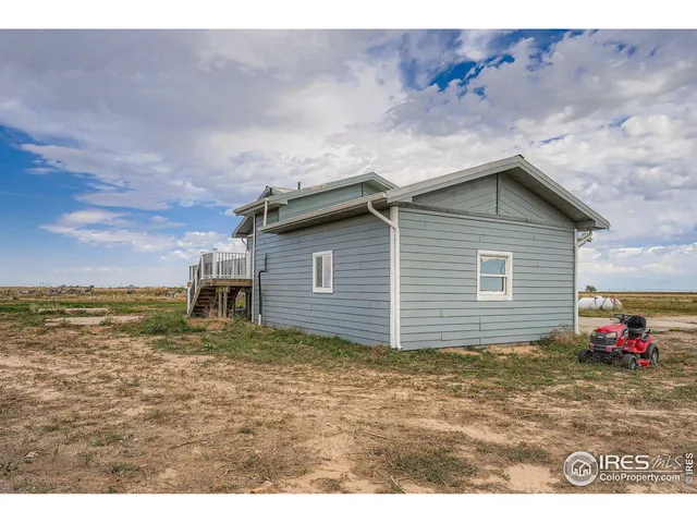 a backyard of a house with wooden fence