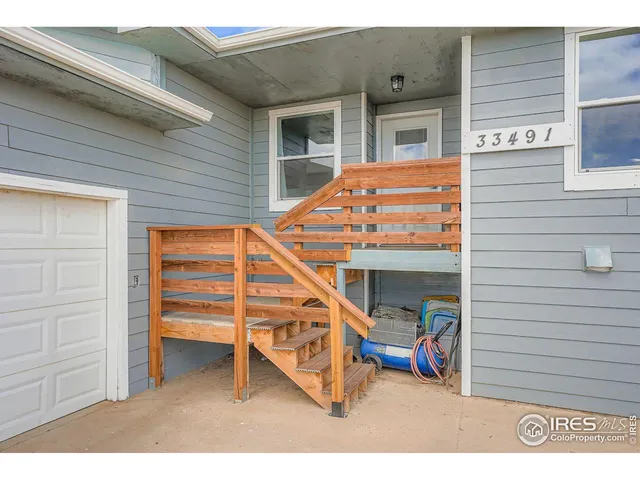 a backyard of a house with outdoor seating
