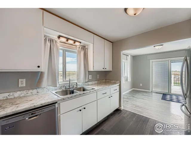 a kitchen with sink and cabinets