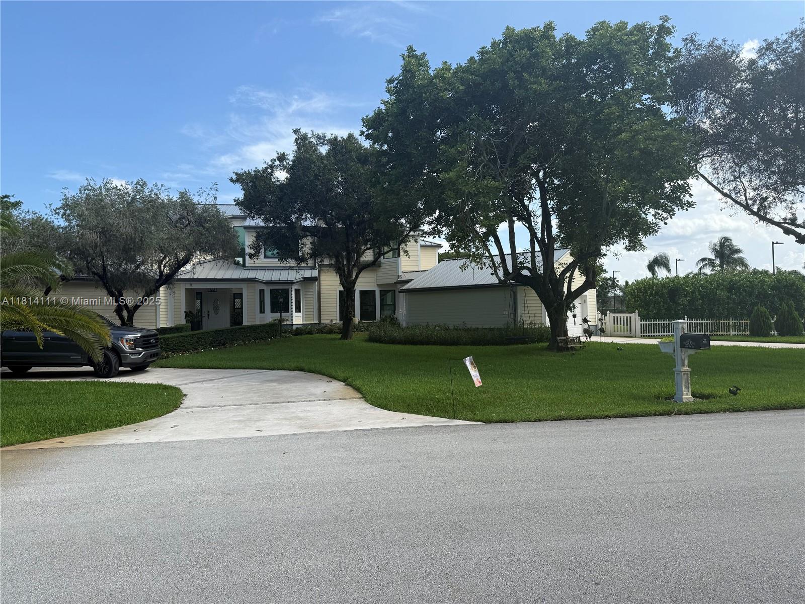 11820 Northwest 5th Street Plantation, FL 33325 - Photo 1 of 6 a front view of a house with a yard