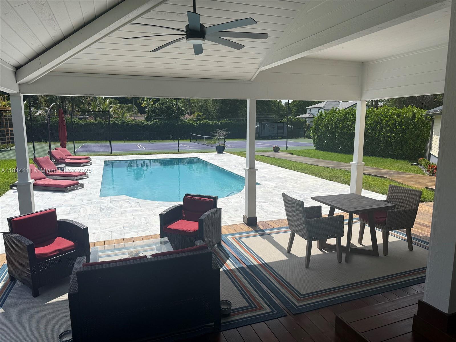 11820 Northwest 5th Street Plantation, FL 33325 - Photo 3 of 6 a outdoor space with patio the couches and pool table with chairs