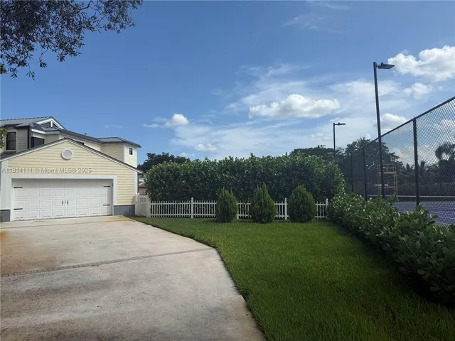 a house view with a play ground in front of it