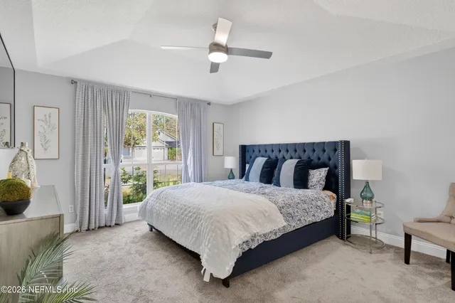 a bedroom with a bed and a couch