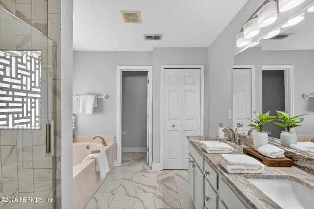 a room with a couch and a view of bathroom