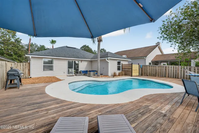 a view of pool with outdoor seating