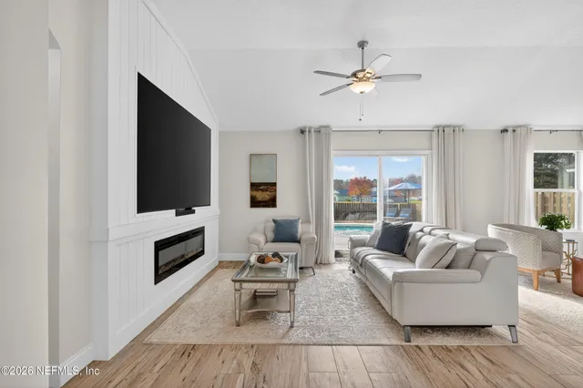 a living room with furniture and a flat screen tv