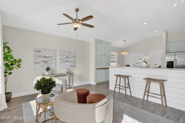 a kitchen with a table and chairs