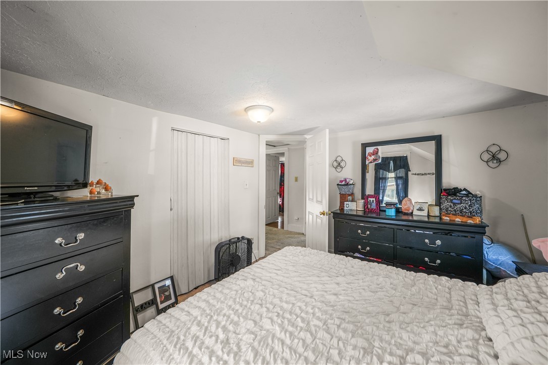 1951 Walton Road Kent, OH 44240 - Photo 12 of 19 Bedroom featuring a textured ceiling