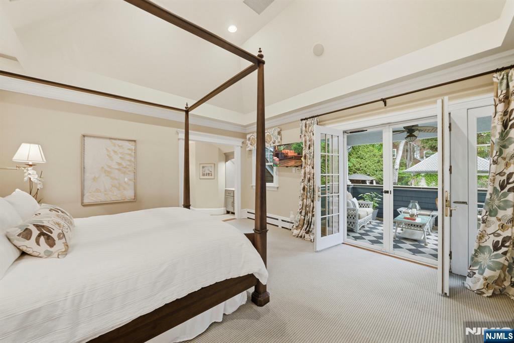 203 Heights Road Ridgewood, NJ 07450 - Photo 12 of 41 a bedroom with a bed and a large window