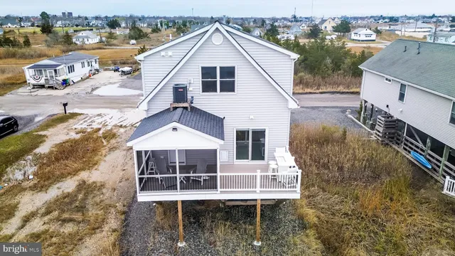 a aerial view of a house with a yard from a balcony