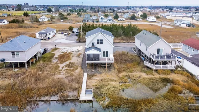 an aerial view of a house with outdoor space lake view
