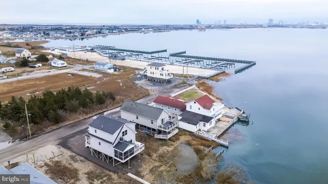an aerial view of a house with lake view