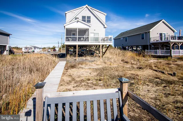 a front view of a house with a ocean view