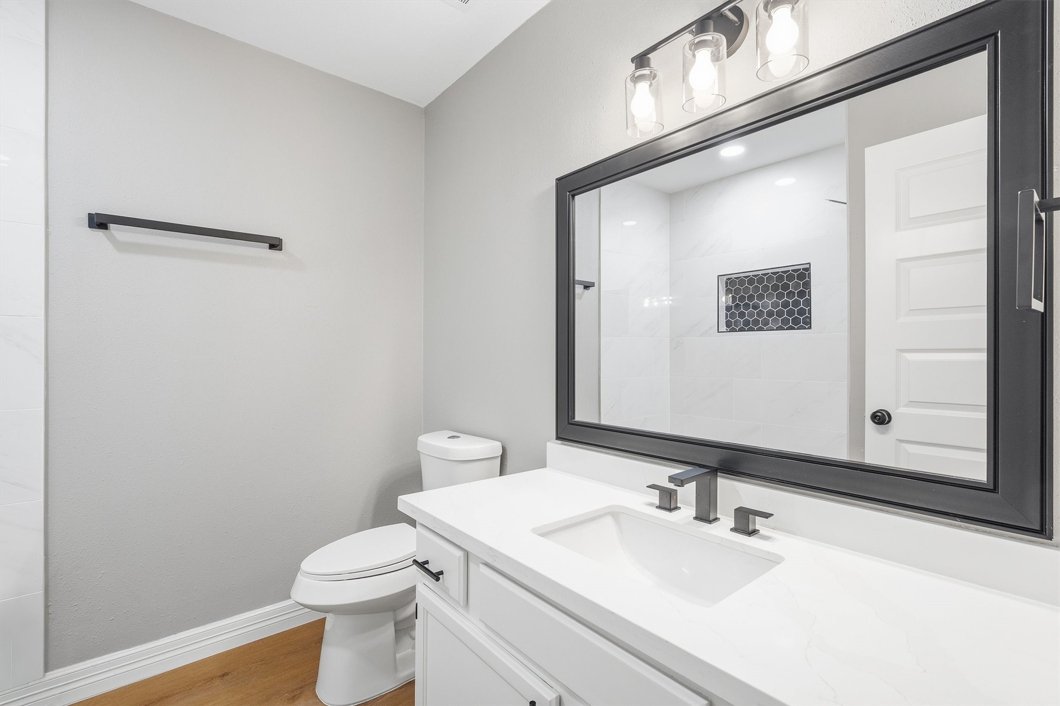 3 Still Corner Place Spring, TX 77381 - Photo 23 of 34 The second full bath keeps things fresh with quartz counters and a sleek framed mirror, matching the same clean finishes found throughout the home.