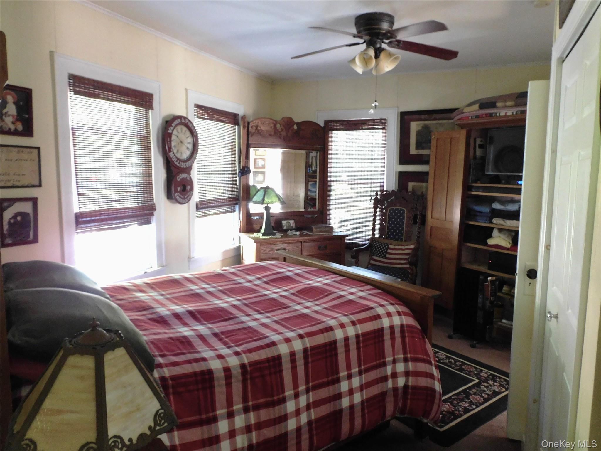 18-20 Church Road Mountain Dale, NY 12763 - Photo 17 of 20 a bedroom with a bed and dresser with mirror