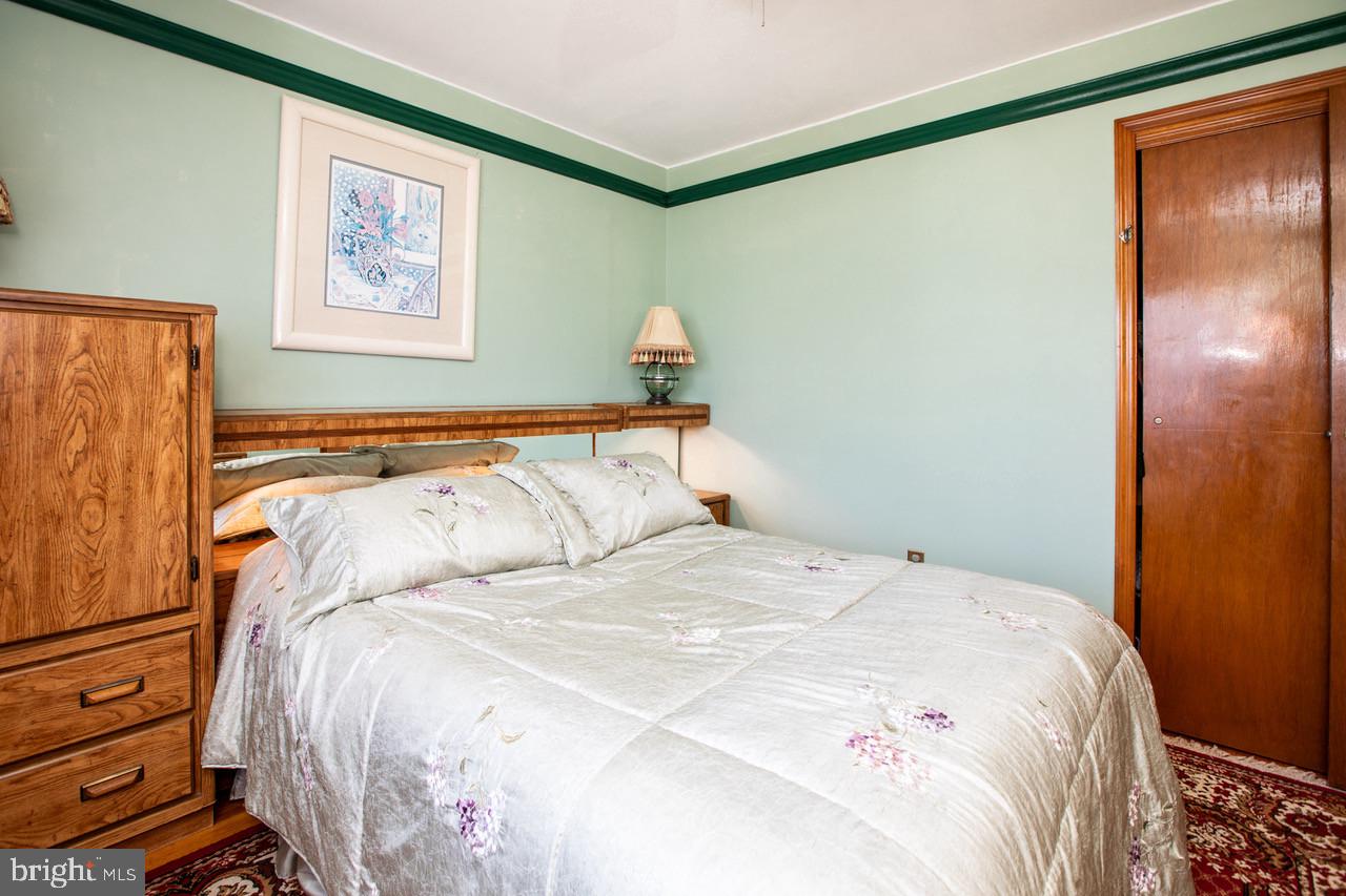 38 Albemarle Road Hamilton, NJ 08690 - Photo 18 of 39 a bedroom with a bed and a painting on the wall