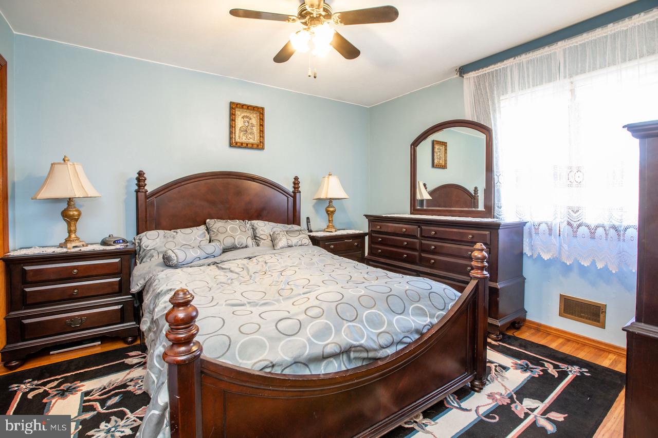38 Albemarle Road Hamilton, NJ 08690 - Photo 20 of 39 a bed room with a bed and a chandelier