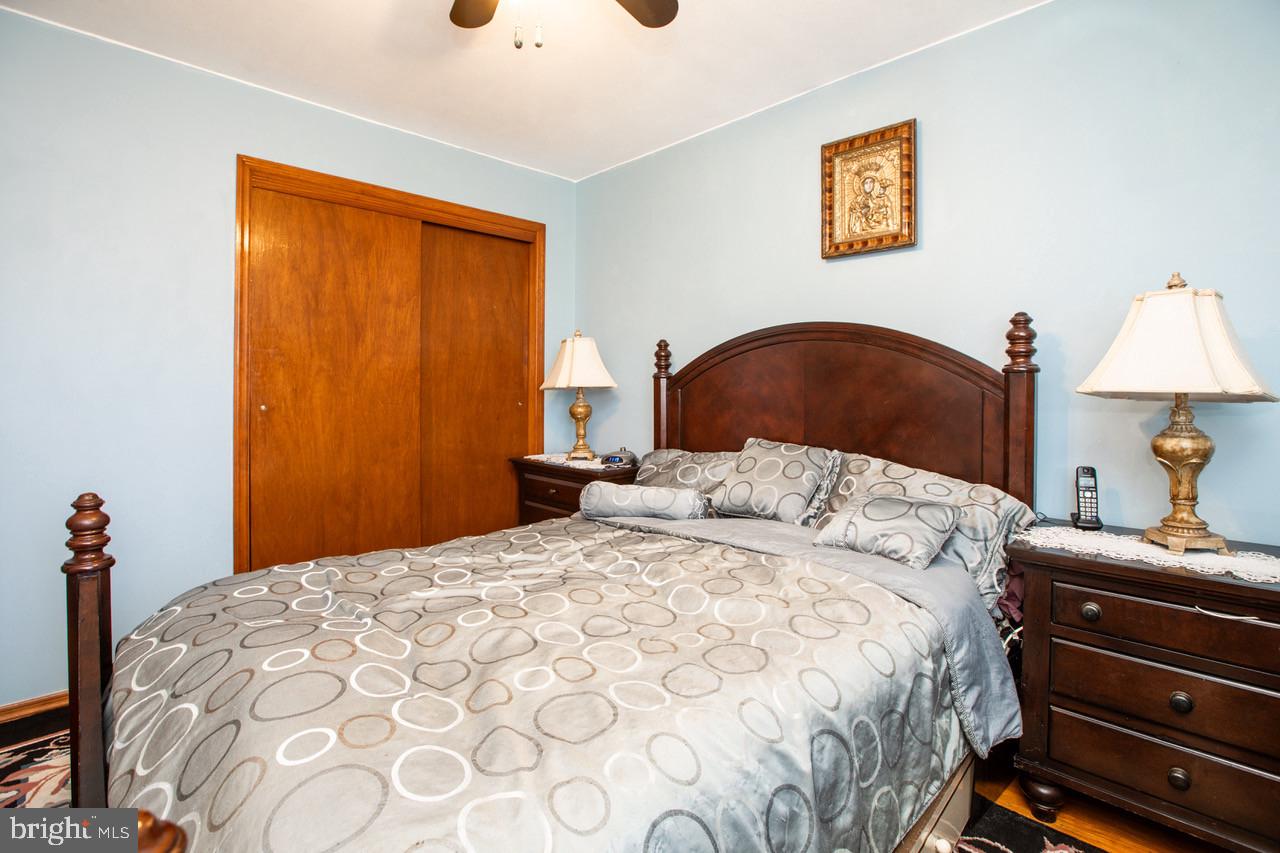 38 Albemarle Road Hamilton, NJ 08690 - Photo 21 of 39 a bedroom with a bed and a lamp