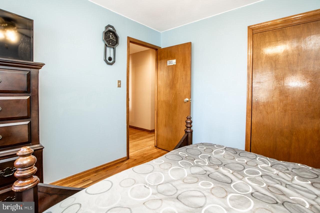 38 Albemarle Road Hamilton, NJ 08690 - Photo 22 of 39 a bedroom with a bed and a flat screen tv