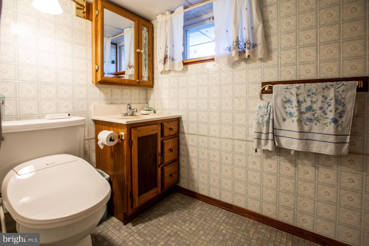 38 Albemarle Road Hamilton, NJ 08690 - Photo 30 of 39 a bathroom with a sink a toilet and mirror