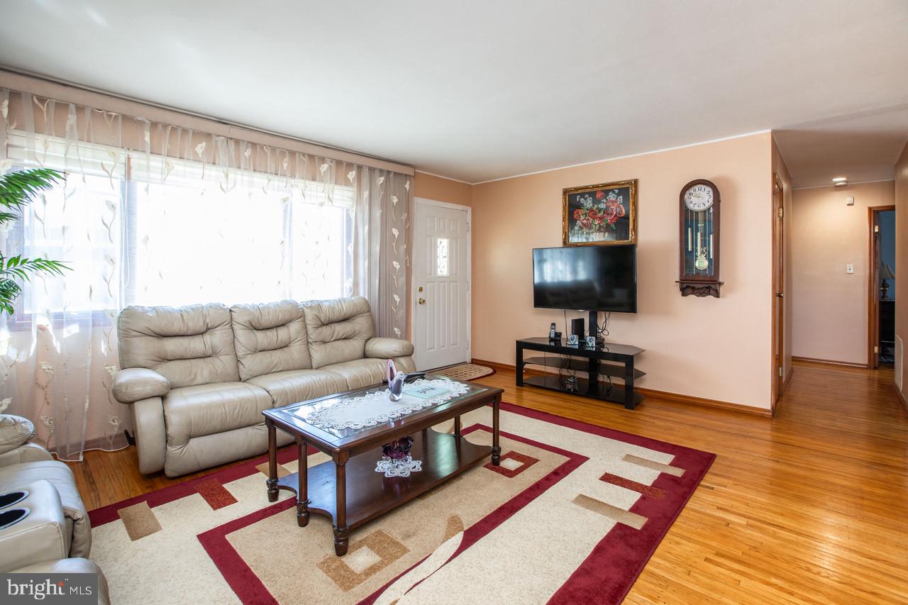 38 Albemarle Road Hamilton, NJ 08690 - Photo 5 of 39 a living room with furniture and a flat screen tv