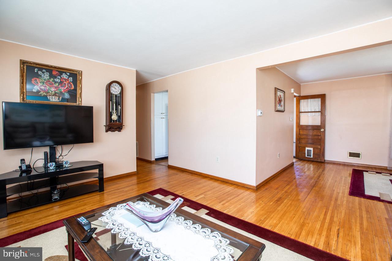 38 Albemarle Road Hamilton, NJ 08690 - Photo 6 of 39 a living room with furniture and a flat screen tv