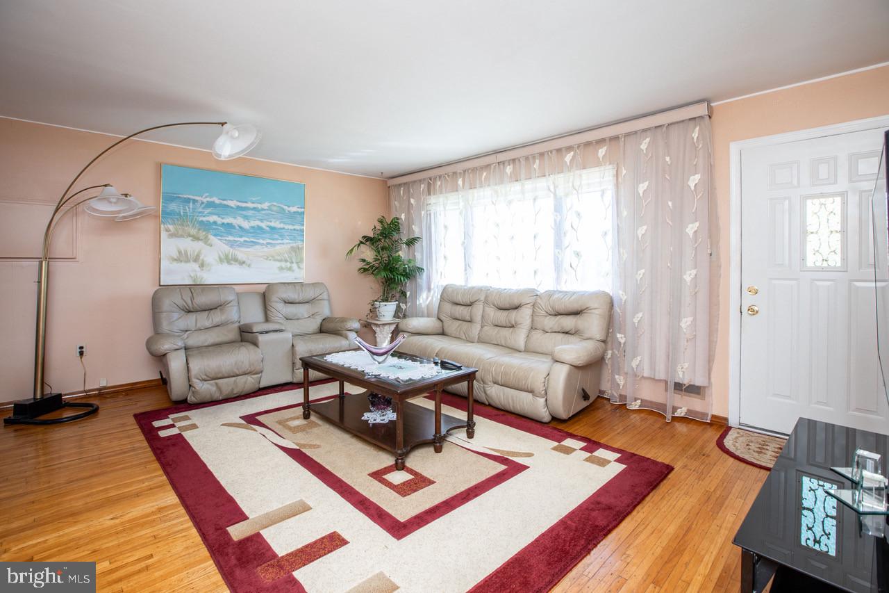 38 Albemarle Road Hamilton, NJ 08690 - Photo 7 of 39 a living room with furniture a rug and a window