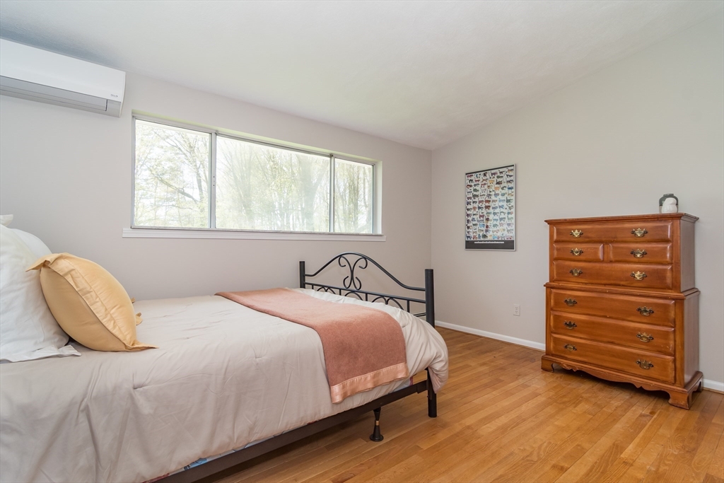 9 Clearview Drive Natick, MA 01760 - Photo 13 of 27 a bedroom with a bed and a chair