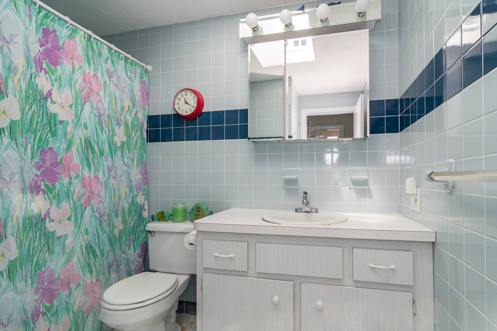 9 Clearview Drive Natick, MA 01760 - Photo 14 of 27 a bathroom with a sink and a toilet