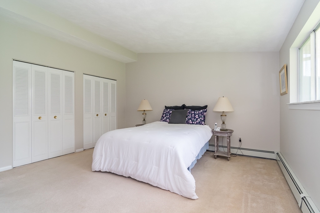 9 Clearview Drive Natick, MA 01760 - Photo 17 of 27 a bedroom with a bed and a window