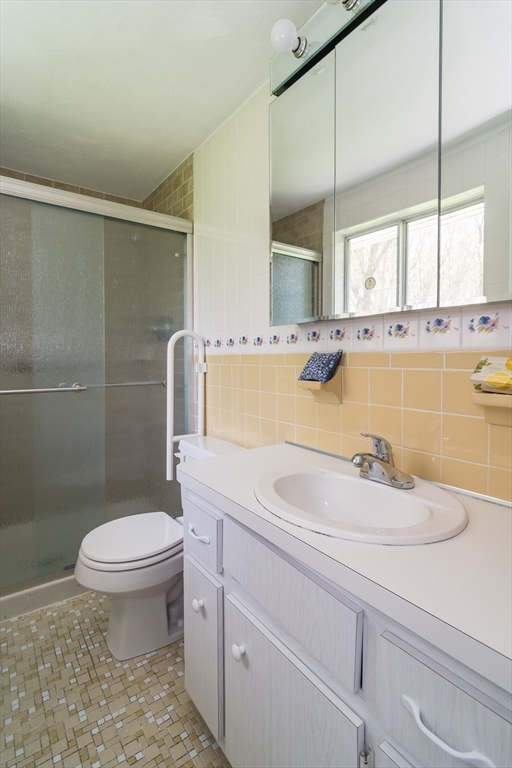 9 Clearview Drive Natick, MA 01760 - Photo 19 of 27 a bathroom with a sink a toilet and bathtub