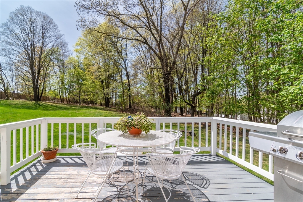 9 Clearview Drive Natick, MA 01760 - Photo 26 of 27 a view of a table and chairs on the deck