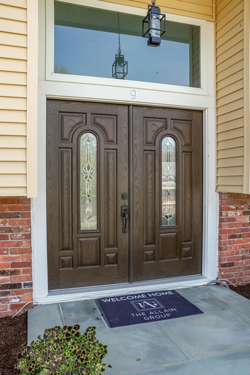 9 Clearview Drive Natick, MA 01760 - Photo 4 of 27 a front view of a house with entryway