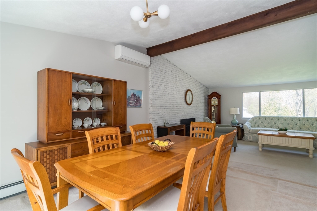 9 Clearview Drive Natick, MA 01760 - Photo 8 of 27 a dining room with furniture a rug and a large window