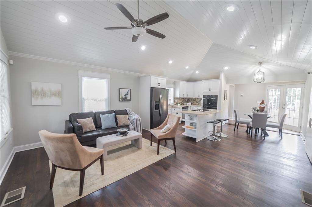 2390 Lynn Iris Drive Decatur, GA 30032 - Photo 1 of 1 a living room with furniture kitchen view and a dining table
