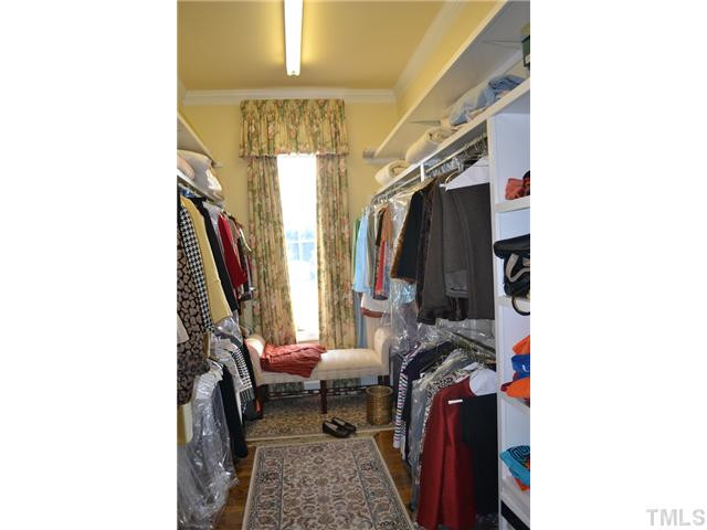 86 Dogeye Road Benson, NC 27504 - Photo 15 of 24 A large walk-in custom closet in the master bedroom has lots of storage and natural light.