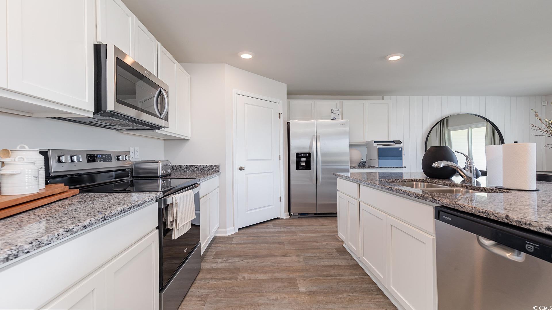 331 Acosta Circle Conway, SC 29527 - Photo 17 of 20 Kitchen featuring light wood-type flooring, sink,
