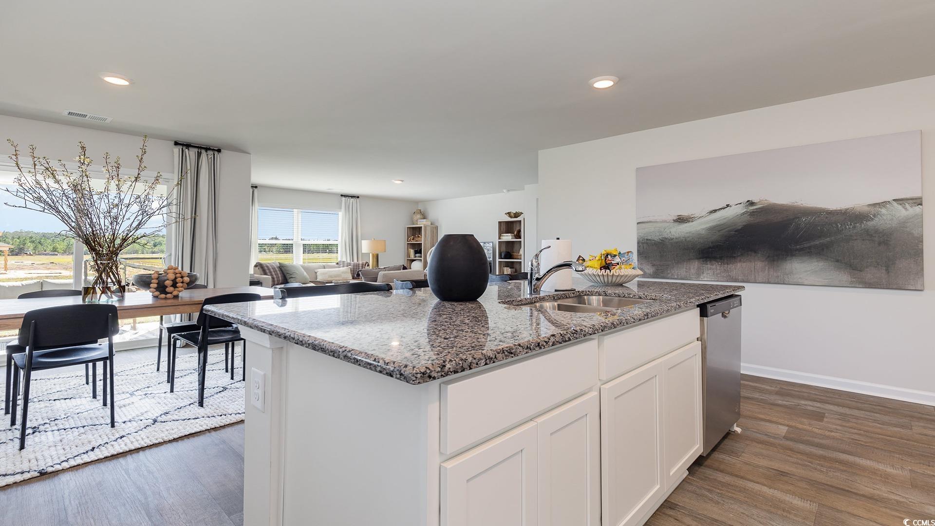 331 Acosta Circle Conway, SC 29527 - Photo 2 of 20 Kitchen with an island with sink, white cabinets,
